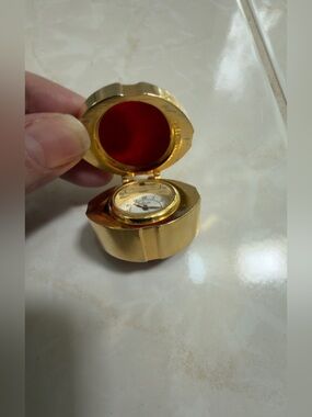 Gold-Tone Compact “gift” Watch with Red Liner
